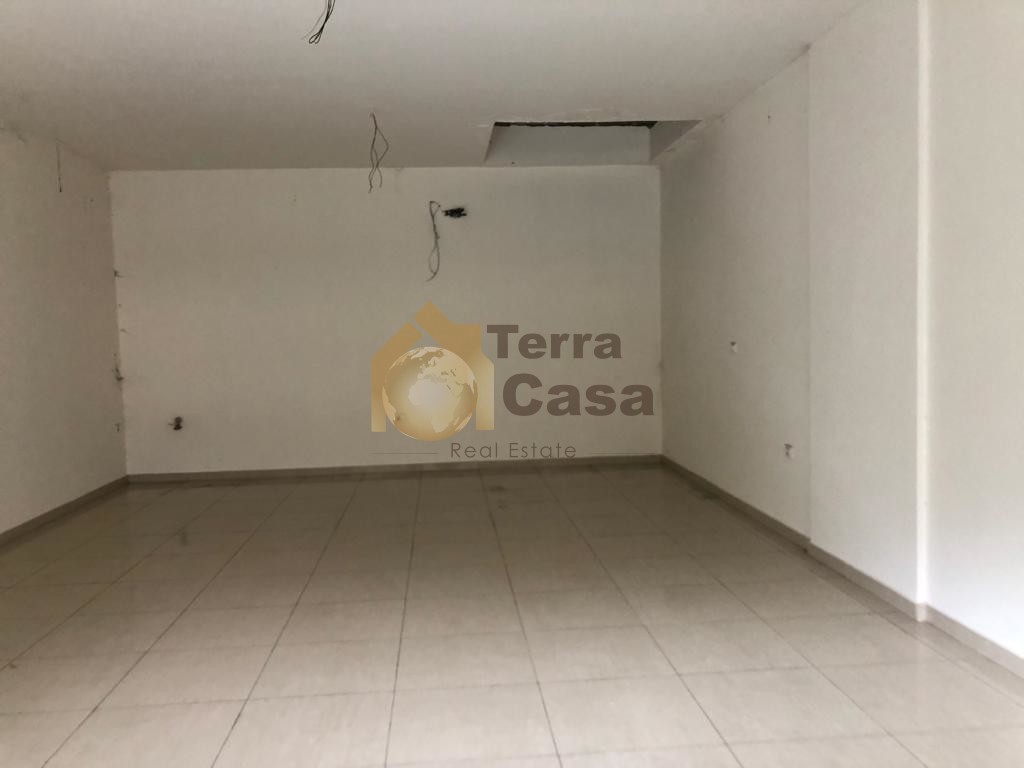 Shop for rent in hazmieh prime location with five parking .