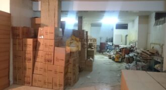 warehouse  haret el bellane with truck entrance banker cheque.